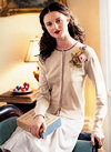 A vintage nod to romance, a chiffon floral corsage adorns this cardigan.