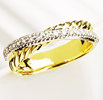 David Yurman. From the Crossover Collection, a pave diamond crossover ring in 18-karat yellow gold. $1,450.00 